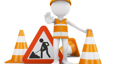 Road worker and  sign